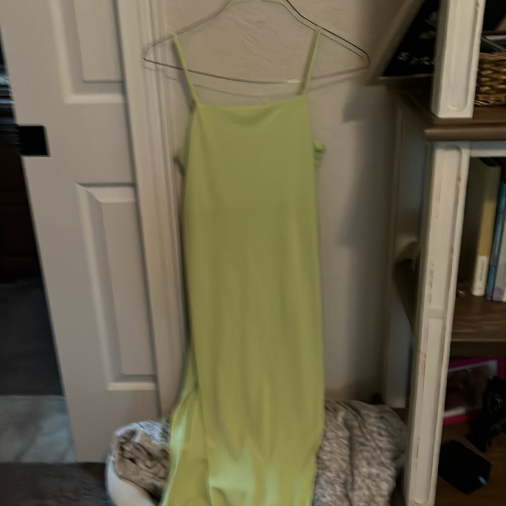 Neon green long dress with open place for leg